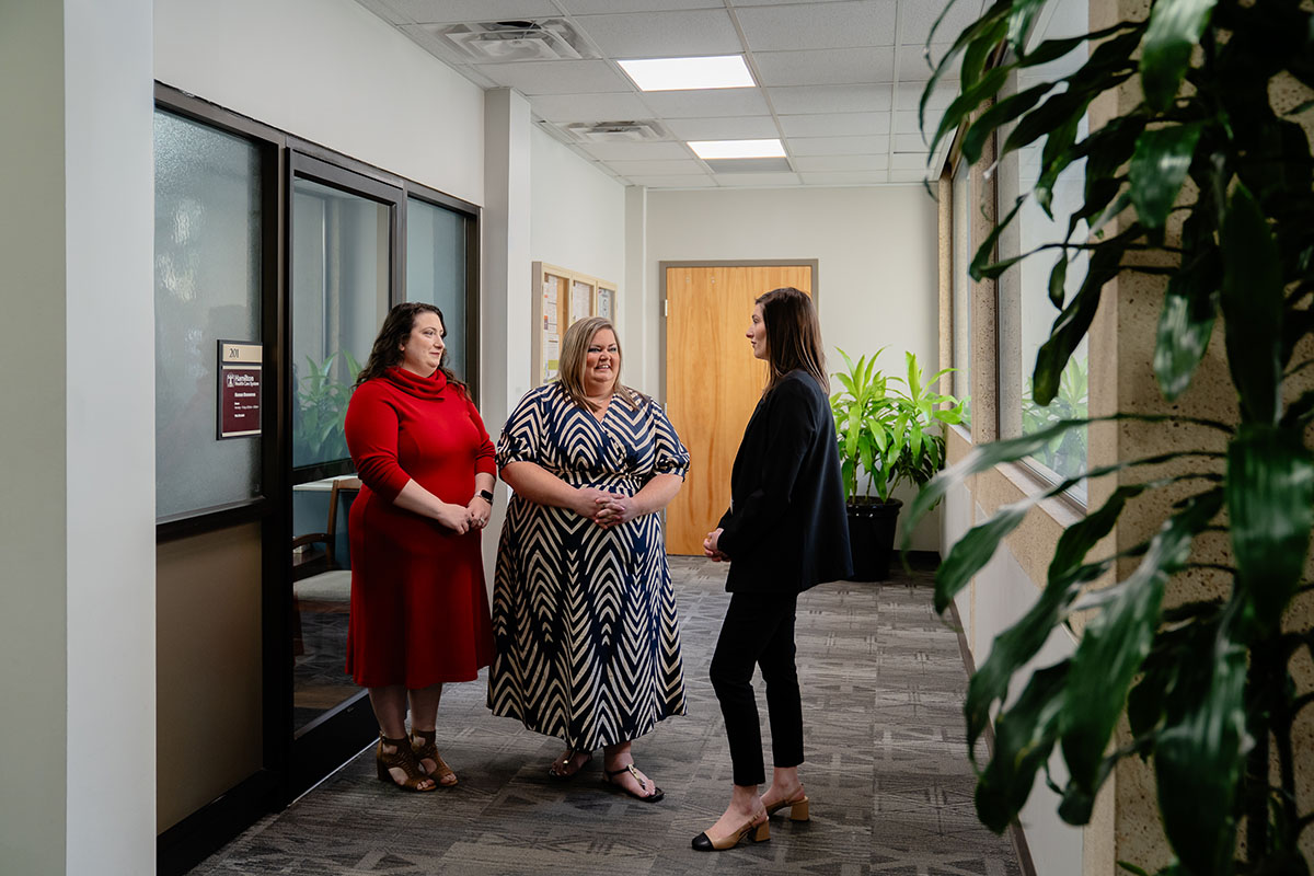 People Talking in Hallway